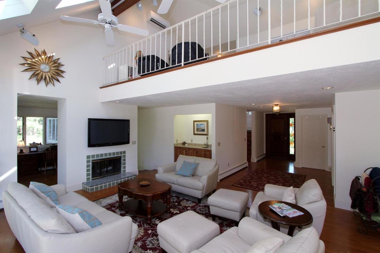 118 Elgin Road Pocasset, MA 02559 - Photo 12 of 35 a living room with furniture fireplace and a flat screen tv