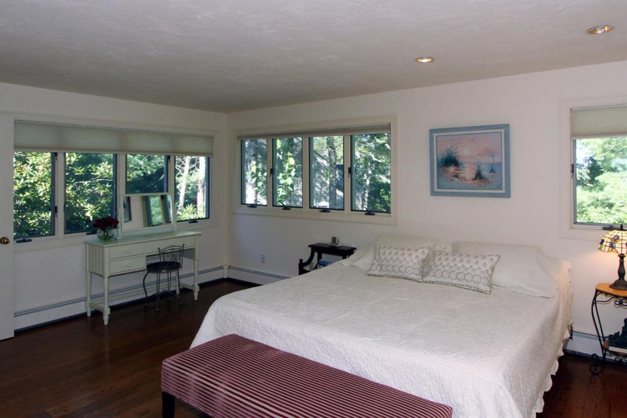 118 Elgin Road Pocasset, MA 02559 - Photo 16 of 35 a bedroom with a large bed and a large window