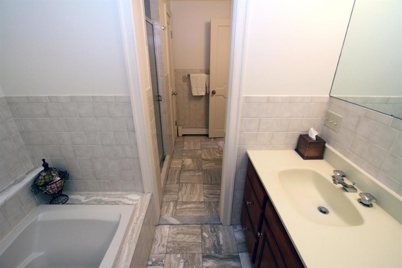 118 Elgin Road Pocasset, MA 02559 - Photo 19 of 35 a bathroom with a sink and a tub