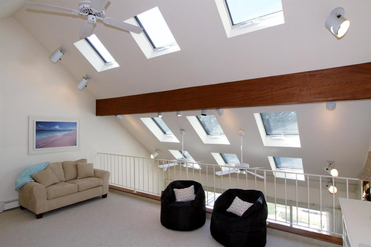 118 Elgin Road Pocasset, MA 02559 - Photo 21 of 35 a living room with furniture and a large window