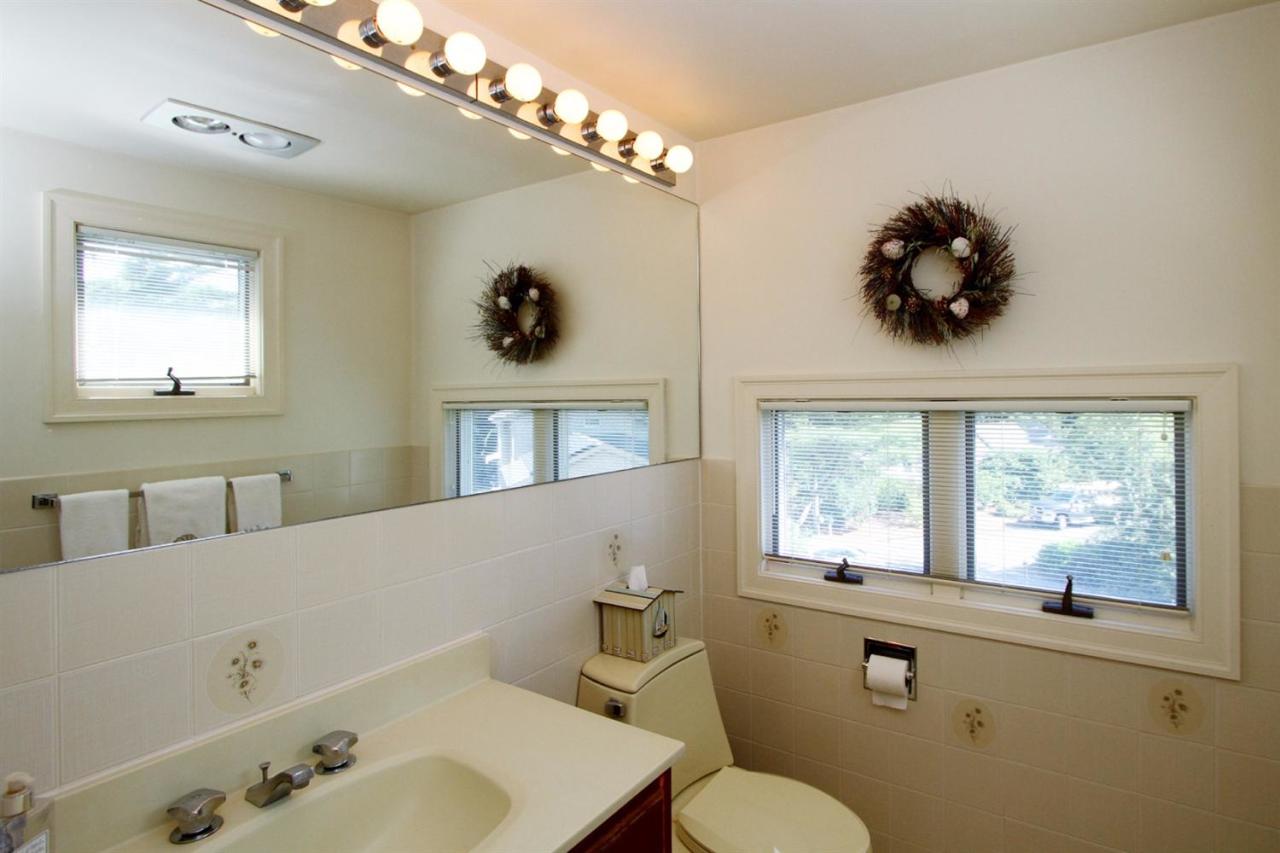 118 Elgin Road Pocasset, MA 02559 - Photo 23 of 35 a bathroom with a sink mirror and a window