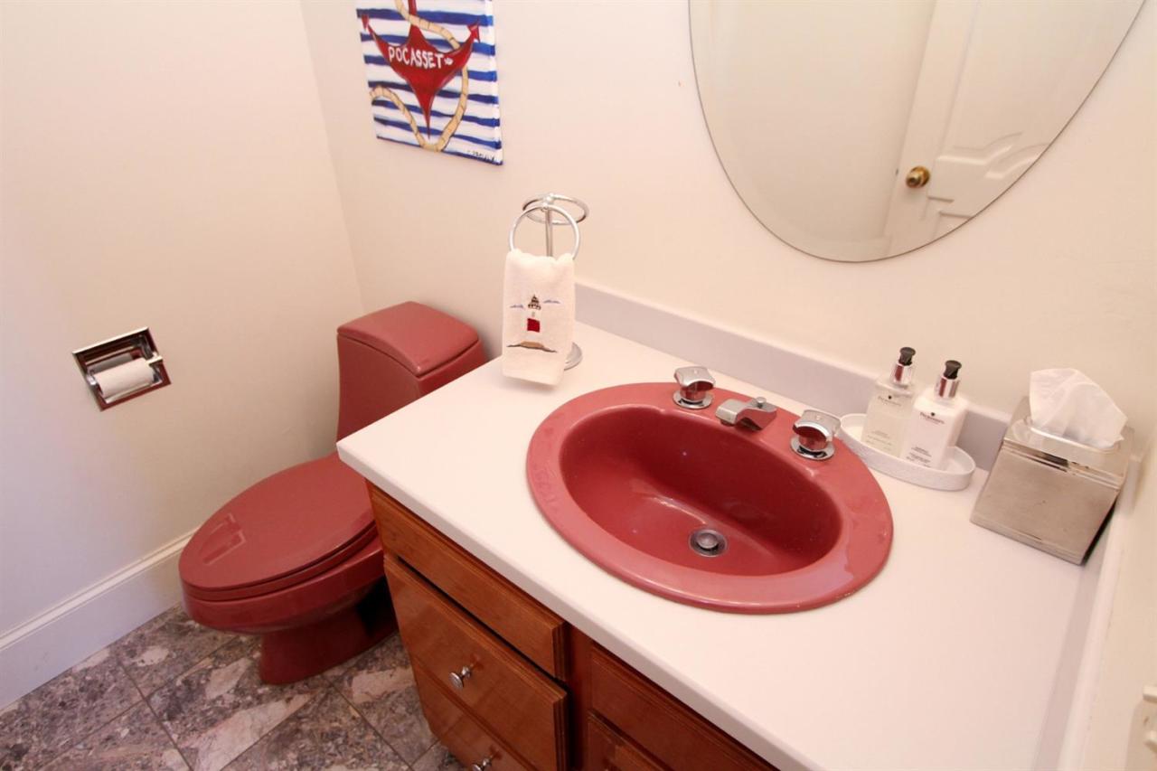 118 Elgin Road Pocasset, MA 02559 - Photo 26 of 35 a bathroom with a sink and a mirror