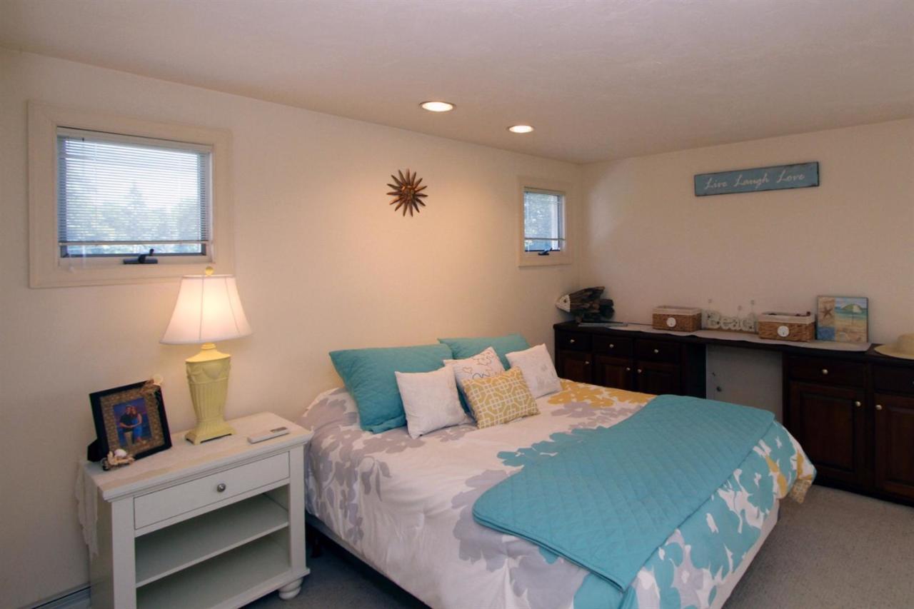 118 Elgin Road Pocasset, MA 02559 - Photo 27 of 35 a bedroom with a bed and window