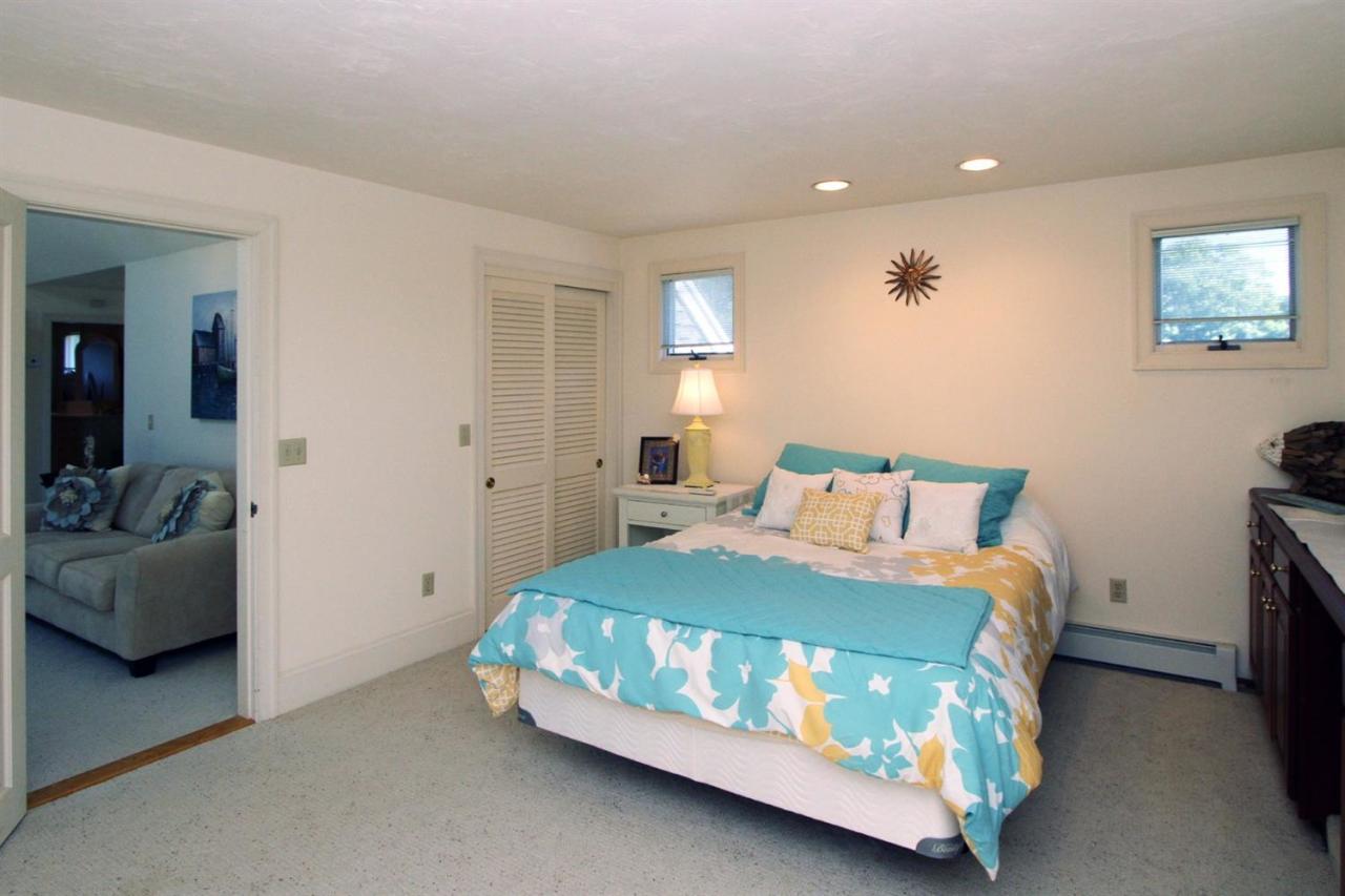118 Elgin Road Pocasset, MA 02559 - Photo 28 of 35 a bedroom with a bed and a couch