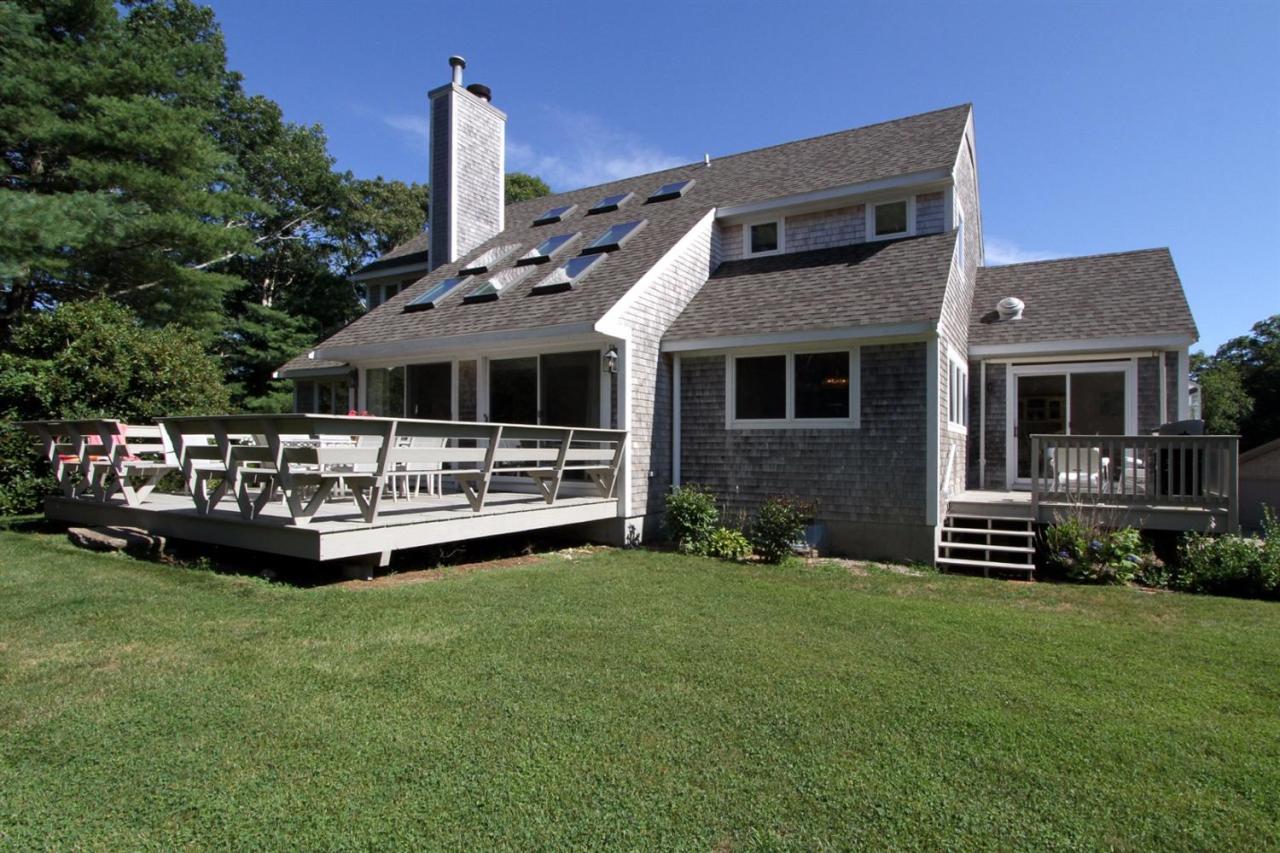 118 Elgin Road Pocasset, MA 02559 - Photo 30 of 35 a front view of a house with a garden