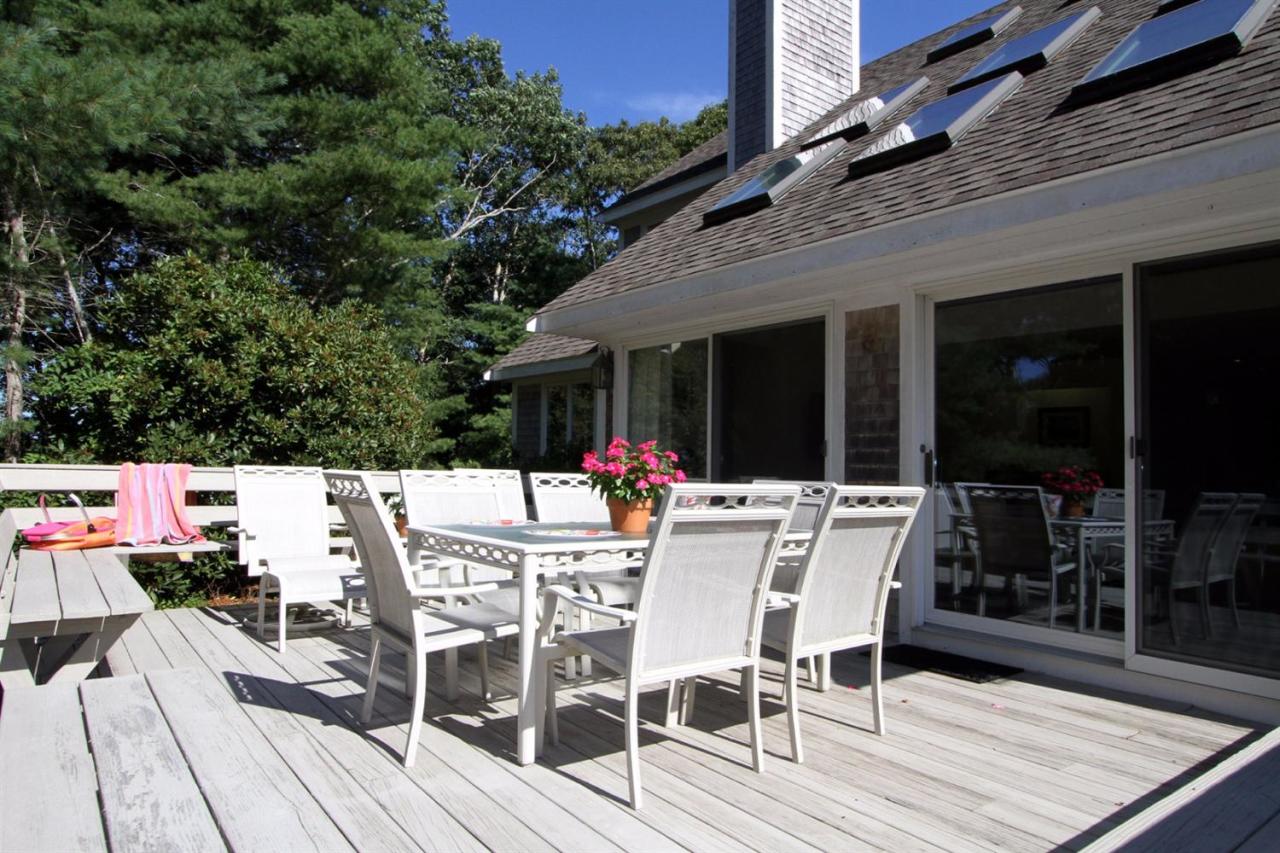118 Elgin Road Pocasset, MA 02559 - Photo 31 of 35 a view of a patio with table and chairs