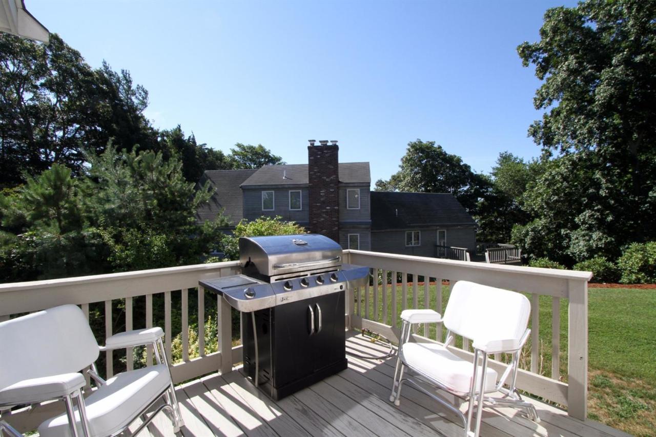 118 Elgin Road Pocasset, MA 02559 - Photo 32 of 35 a balcony with wooden floor table and chairs