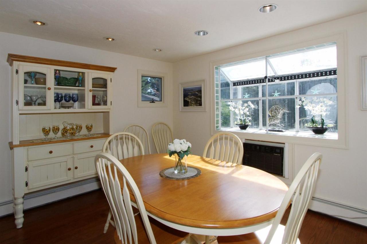 118 Elgin Road Pocasset, MA 02559 - Photo 8 of 35 a dining room with furniture window and wooden floor