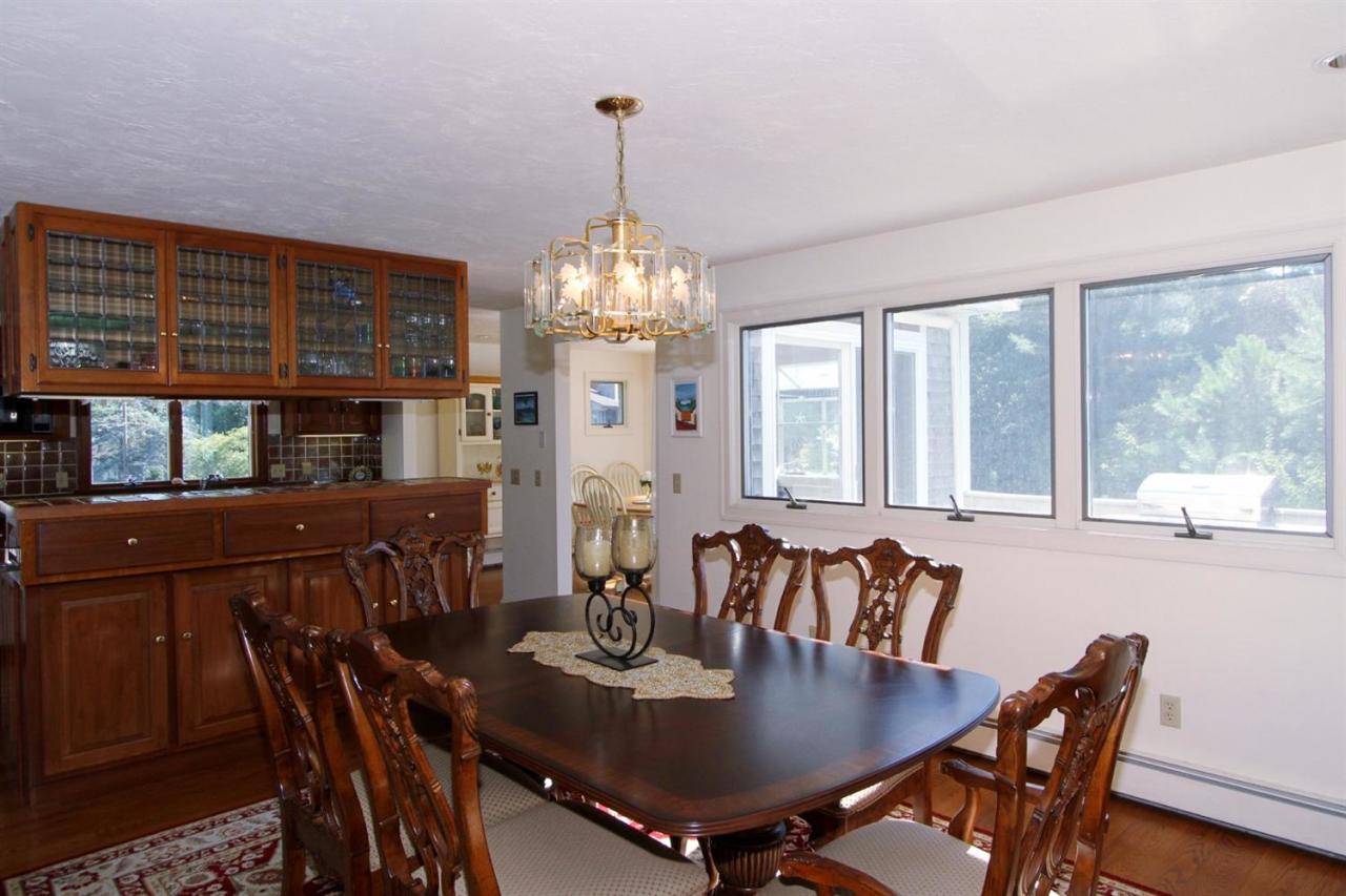 118 Elgin Road Pocasset, MA 02559 - Photo 9 of 35 a view of a dining room with furniture window and outside view