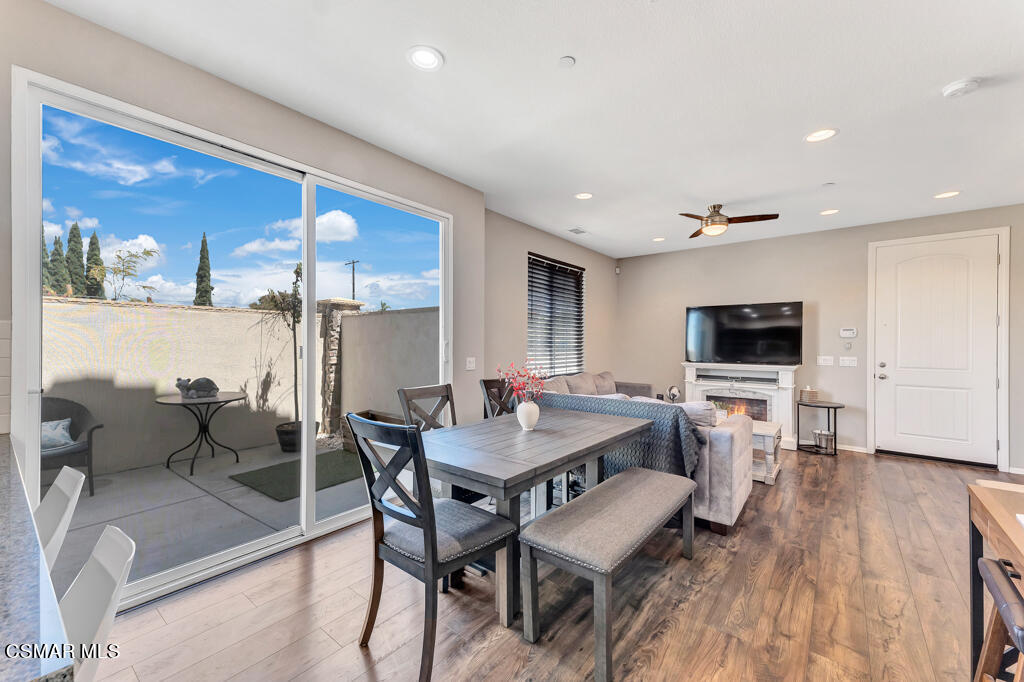 443 Stratus Lane, Unit 3 Simi Valley, CA 93065 - Photo 13 of 41 a view of a dining room with furniture and wooden floor