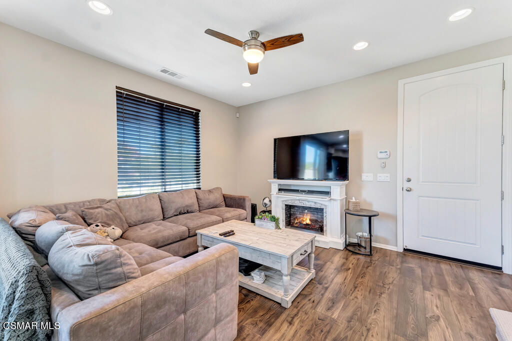 443 Stratus Lane, Unit 3 Simi Valley, CA 93065 - Photo 15 of 41 a living room with furniture and a flat screen tv