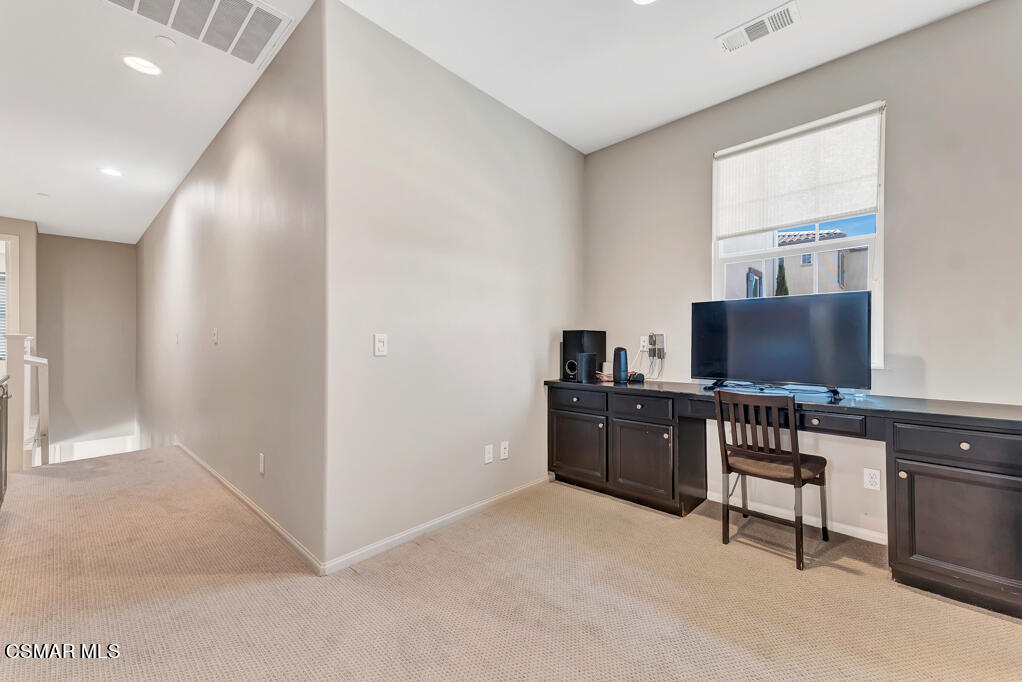 443 Stratus Lane, Unit 3 Simi Valley, CA 93065 - Photo 22 of 41 a living room with furniture and a flat screen tv