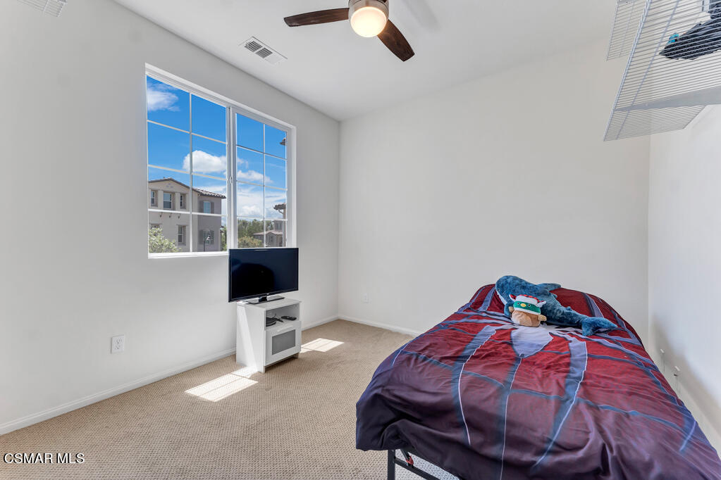 443 Stratus Lane, Unit 3 Simi Valley, CA 93065 - Photo 23 of 41 a view of a bedroom with a bed and furniture