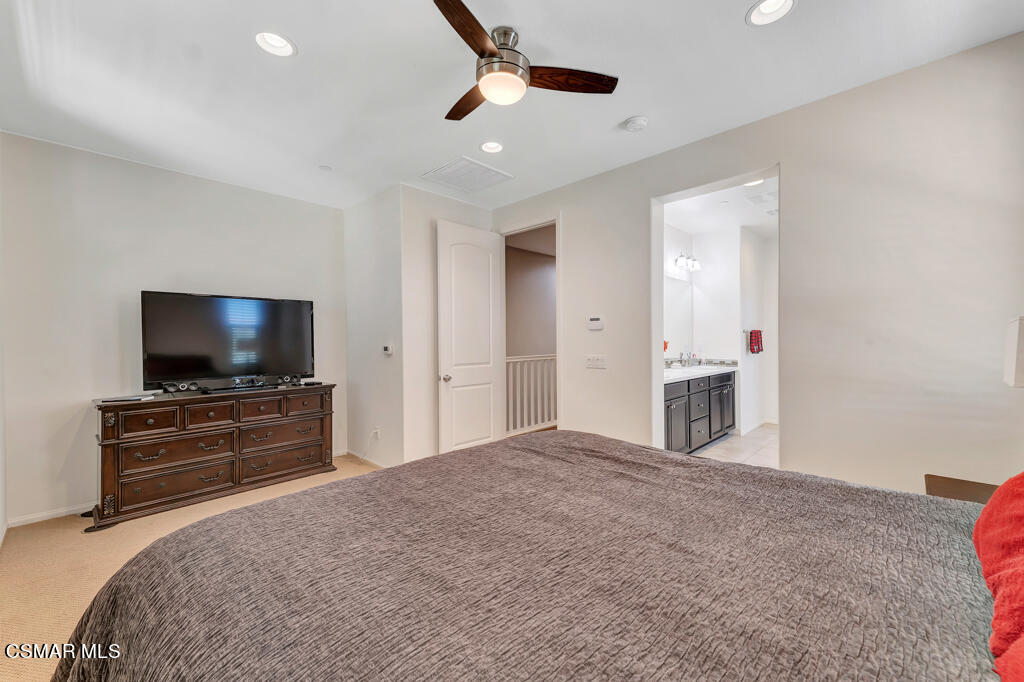 443 Stratus Lane, Unit 3 Simi Valley, CA 93065 - Photo 25 of 41 a bedroom with a bed and a flat screen tv