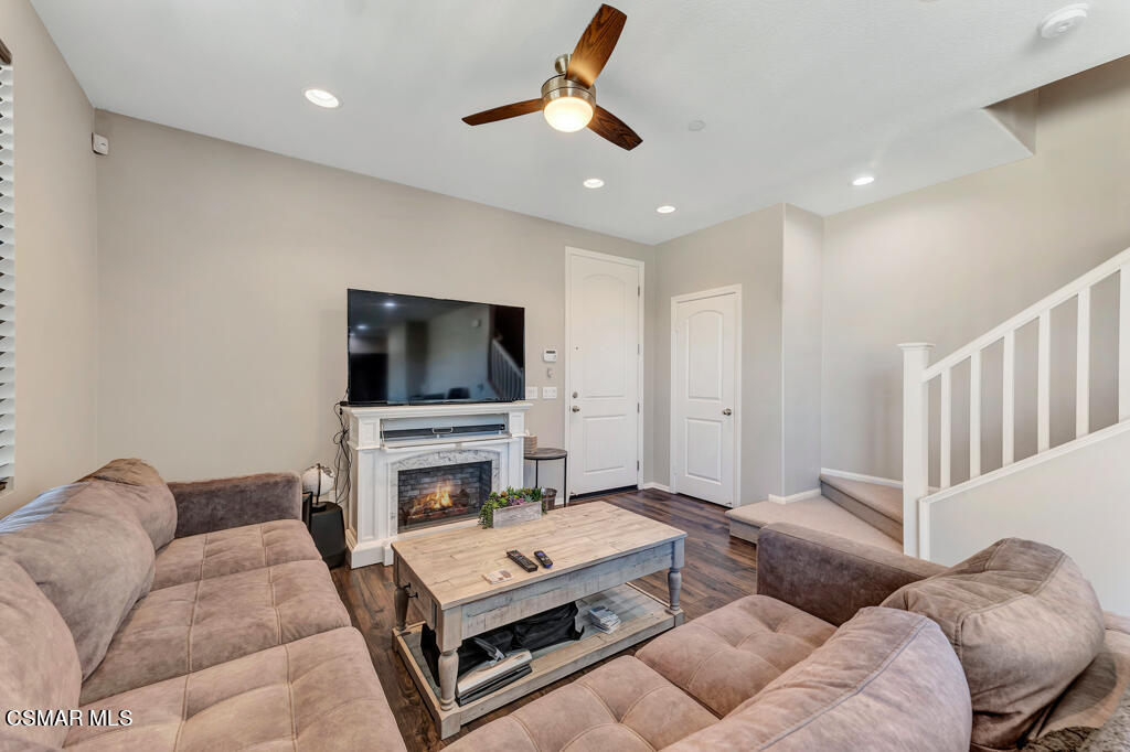 443 Stratus Lane, Unit 3 Simi Valley, CA 93065 - Photo 8 of 41 a living room with furniture and a flat screen tv
