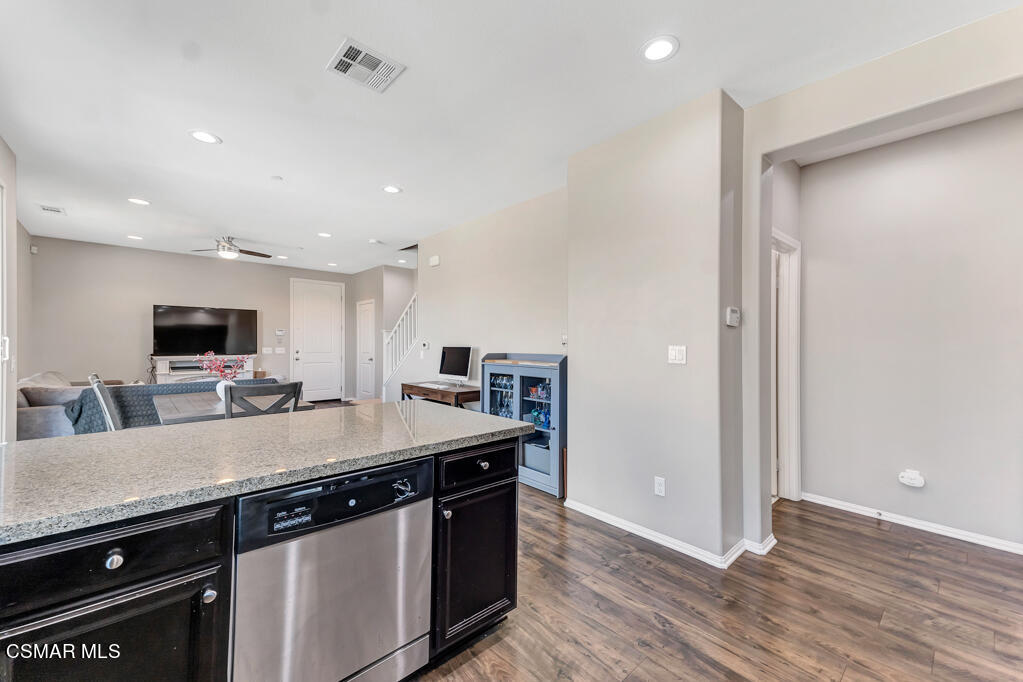443 Stratus Lane, Unit 3 Simi Valley, CA 93065 - Photo 10 of 41 a kitchen with a sink and a refrigerator