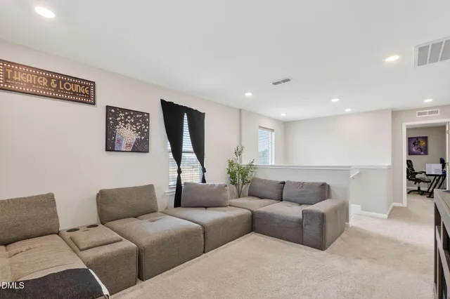 a living room with furniture and a couch