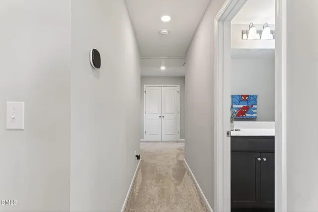 a view of hallway with washer and dryer