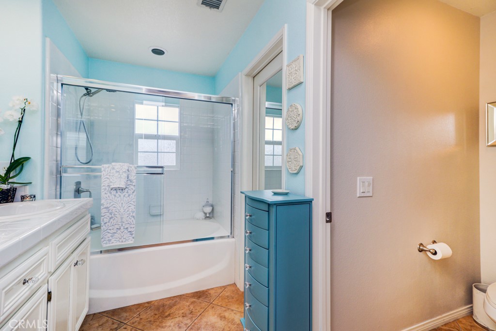 1 Agave Court Ladera Ranch, CA 92694 - Photo 14 of 23 a bathroom with a granite countertop bathtub shower sink vanity and toilet