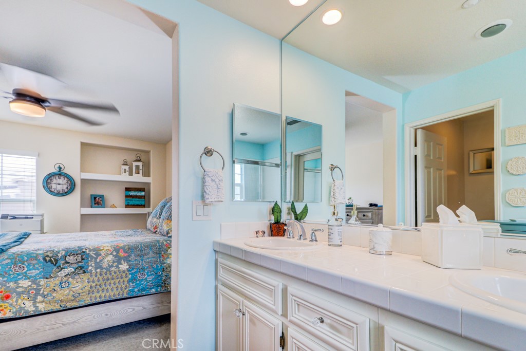 1 Agave Court Ladera Ranch, CA 92694 - Photo 15 of 23 a bathroom with a double vanity sink and a mirror