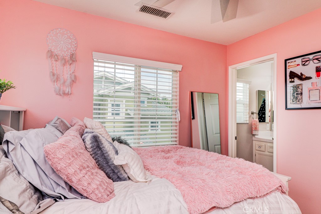 1 Agave Court Ladera Ranch, CA 92694 - Photo 19 of 23 a bedroom with a bed and a large mirror