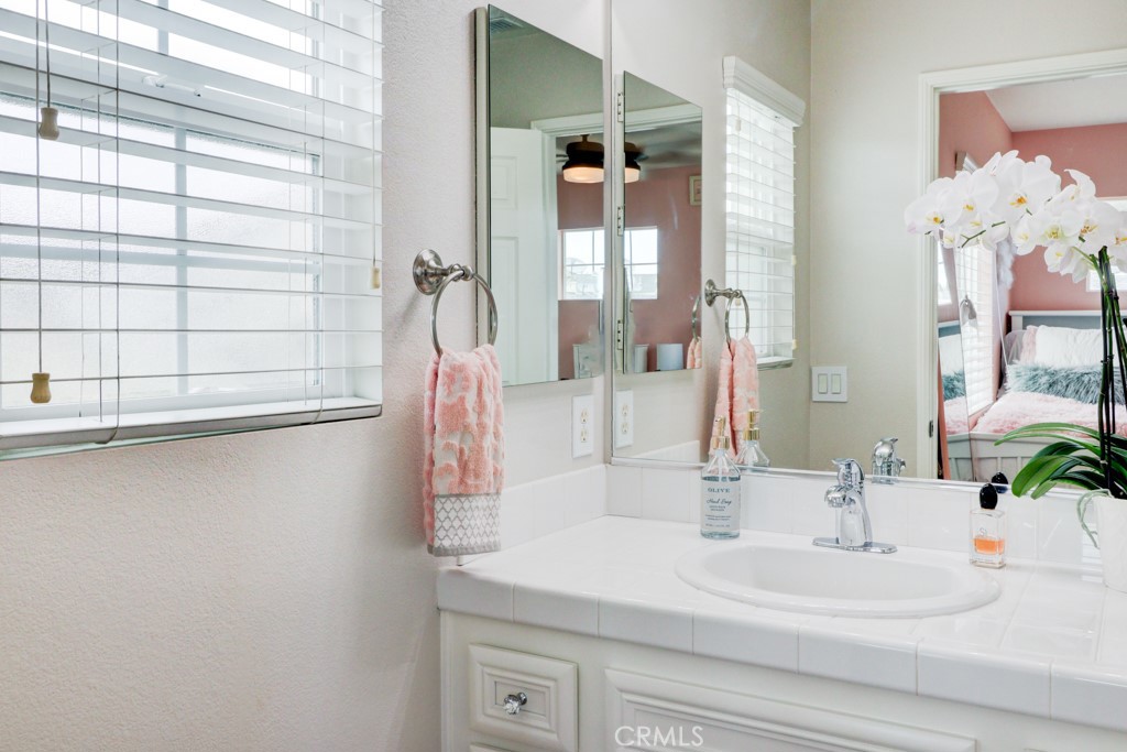 1 Agave Court Ladera Ranch, CA 92694 - Photo 21 of 23 a bathroom with a sink and a mirror