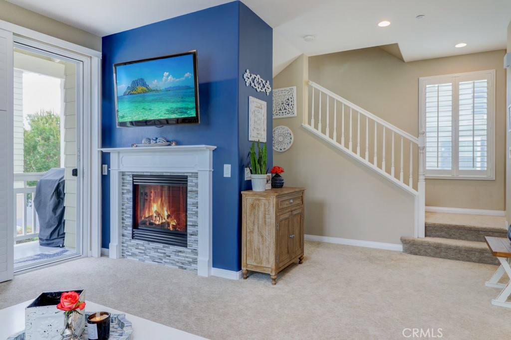1 Agave Court Ladera Ranch, CA 92694 - Photo 7 of 23 a living room with furniture and a fireplace