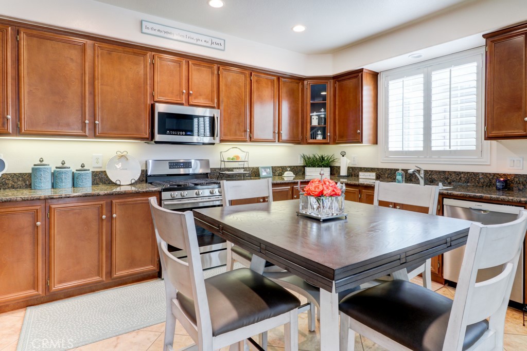 1 Agave Court Ladera Ranch, CA 92694 - Photo 10 of 23 a kitchen with a stove a sink and a refrigerator