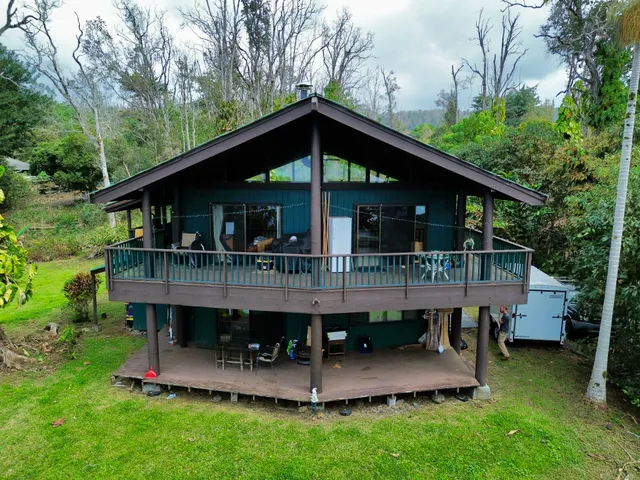 a view of a chair and table in the garden