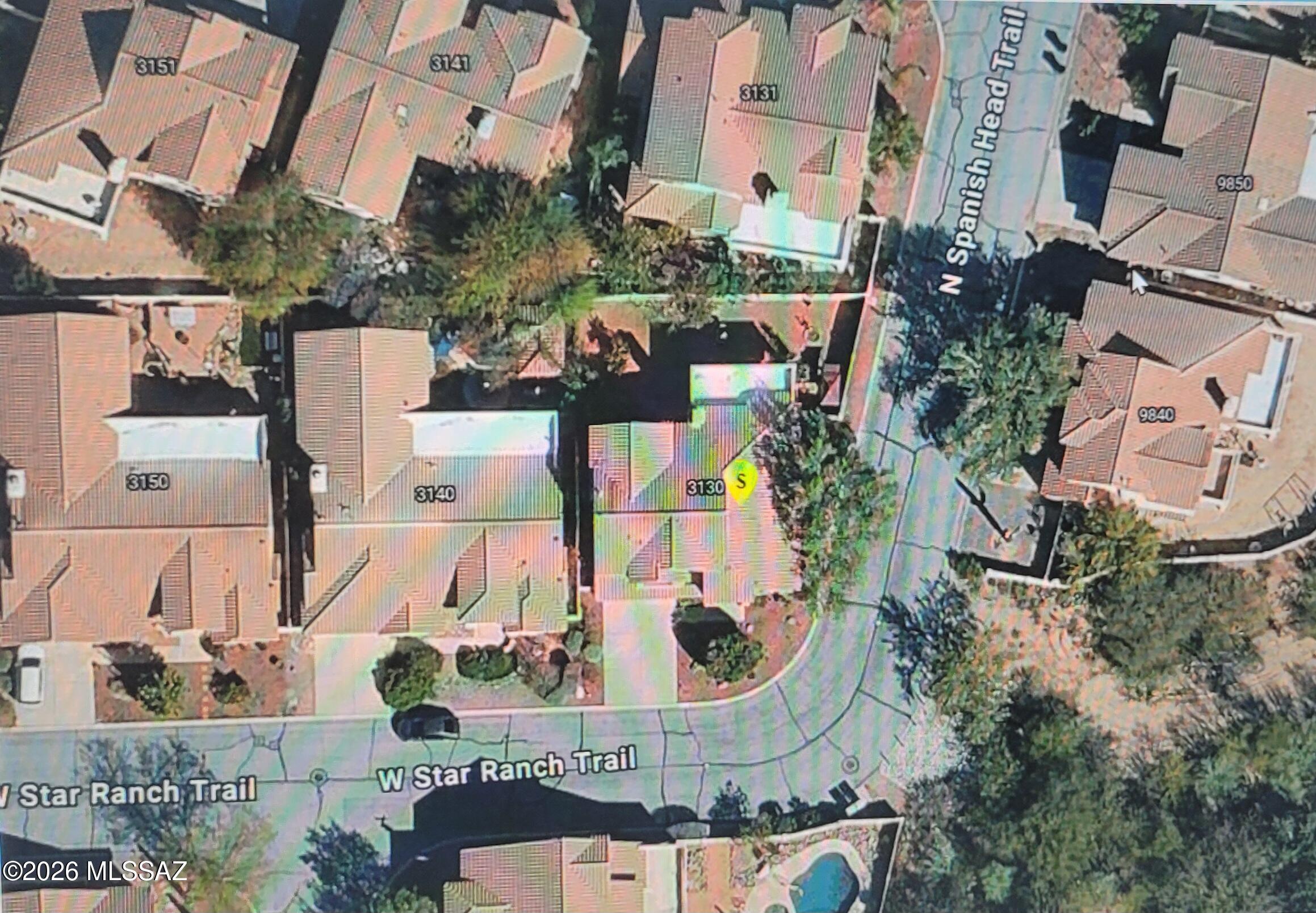 3130 West Star Ranch Trail Tucson, AZ 85742 - Photo 40 of 44 an aerial view of a house with a garden and large trees