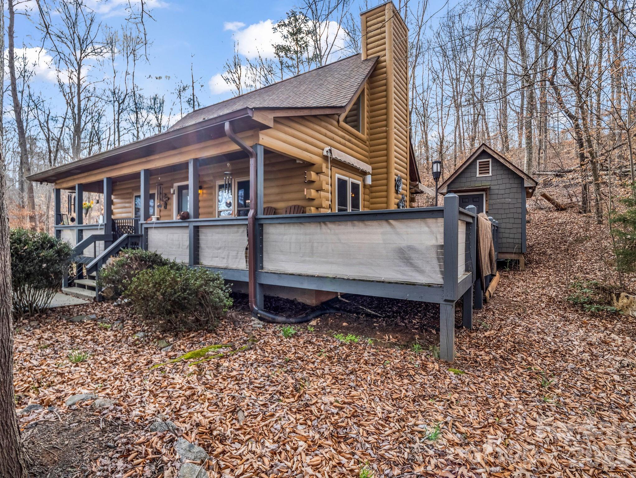 a view of a house with a yard and roof deck