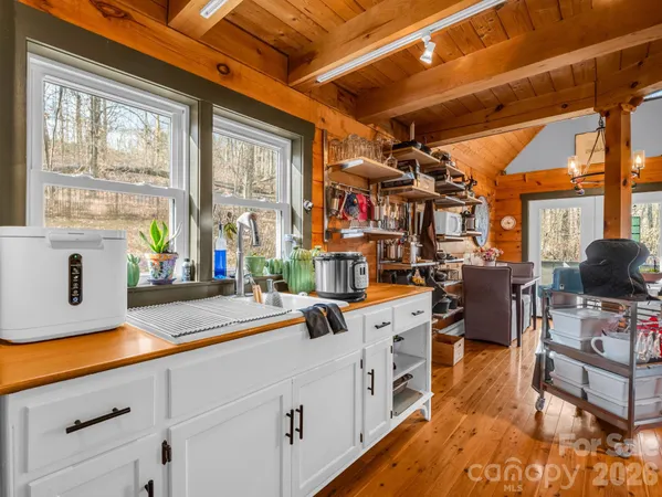 a view of a kitchen with appliances and a window