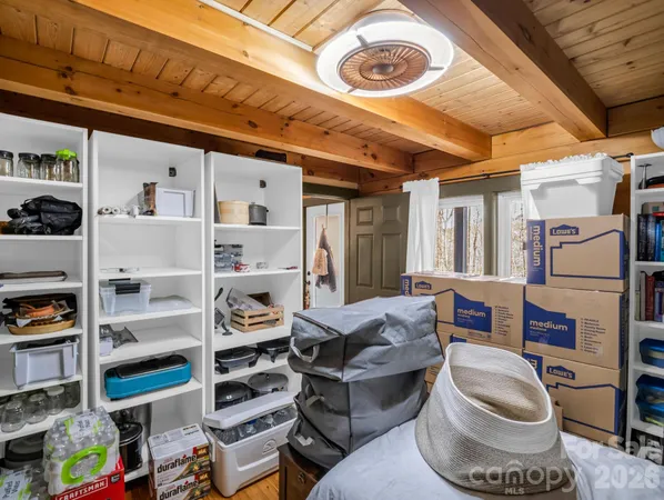 a room with furniture and a book shelf