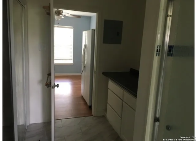 a kitchen that has a sink and a stove