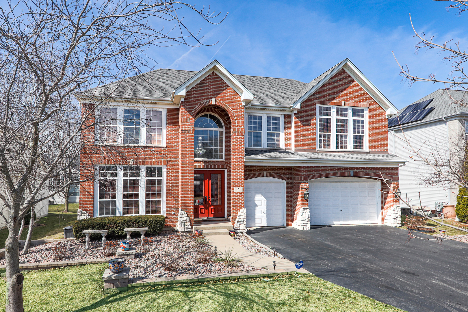 2 Alexander Court Bolingbrook, IL 60490 - Photo 1 of 43 a front view of a house with a yard and garage