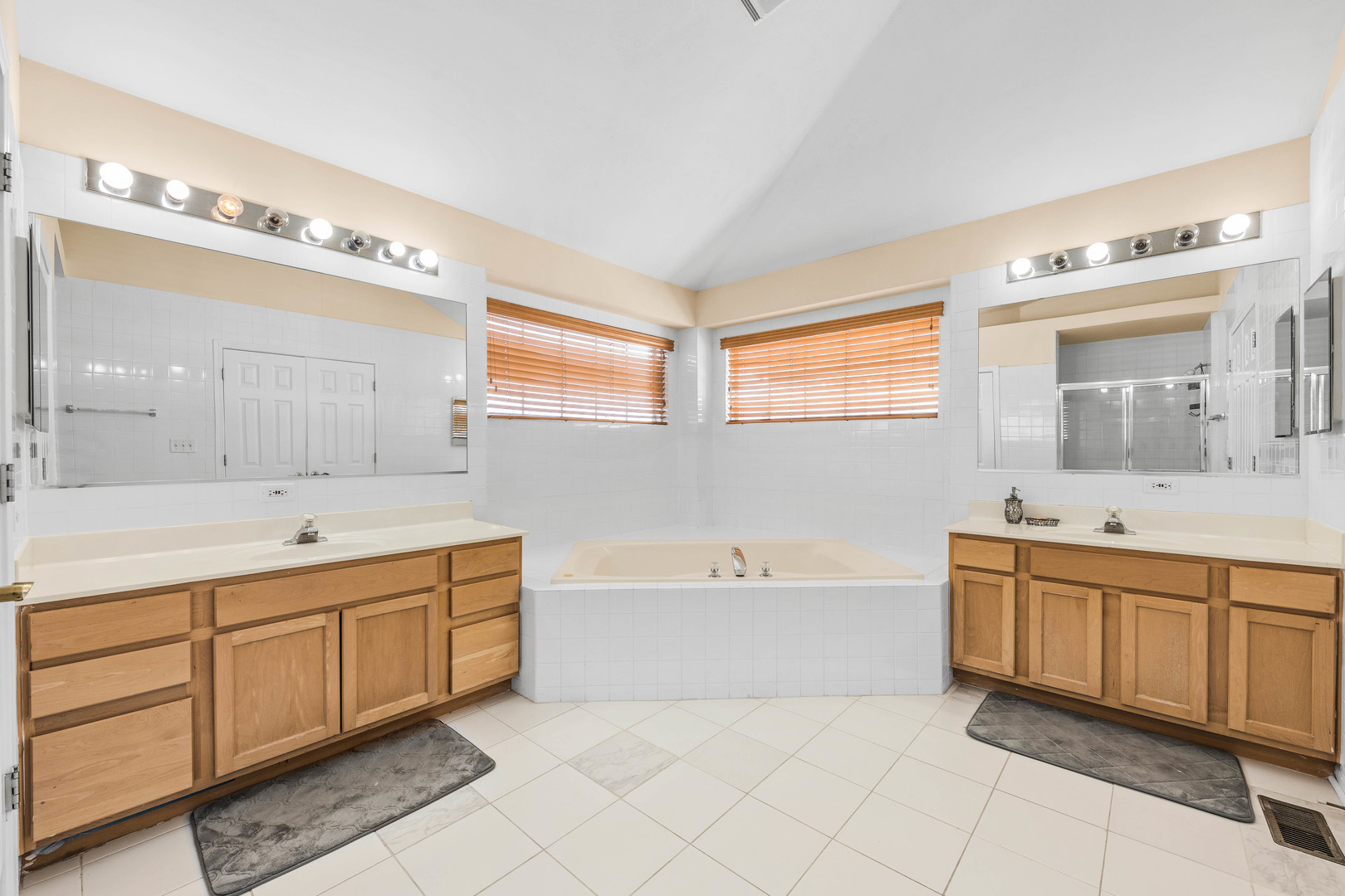 2 Alexander Court Bolingbrook, IL 60490 - Photo 29 of 43 a bathroom with a tub sink and mirror