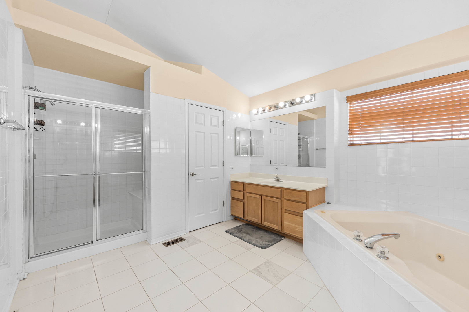 2 Alexander Court Bolingbrook, IL 60490 - Photo 30 of 43 a large spacious bathroom with a tub shower and mirror
