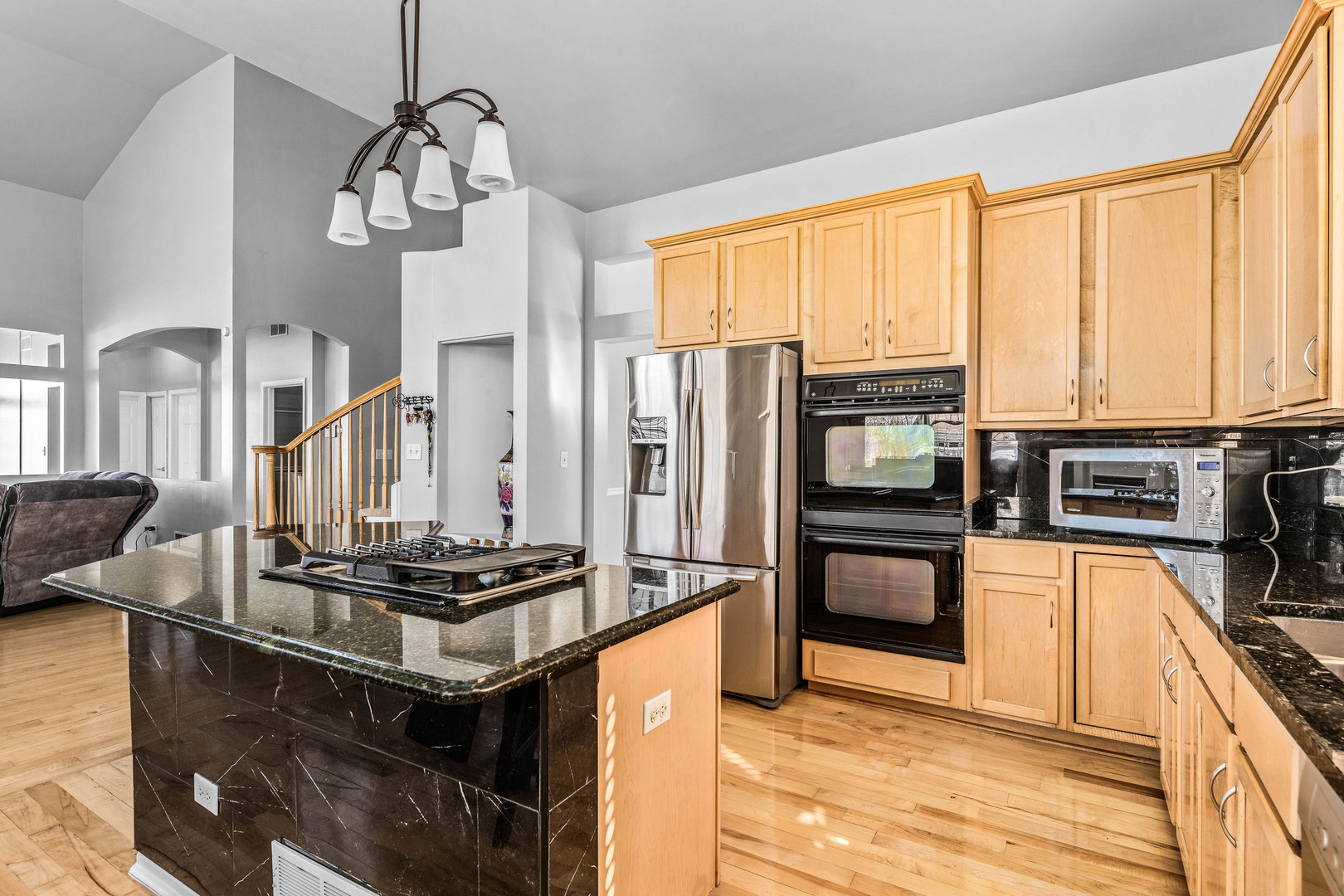 2 Alexander Court Bolingbrook, IL 60490 - Photo 9 of 43 a kitchen with stainless steel appliances granite countertop a stove and a refrigerator
