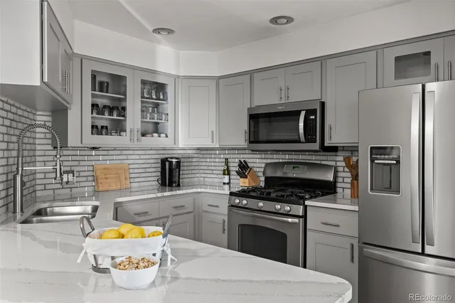 a kitchen with a stove microwave and refrigerator