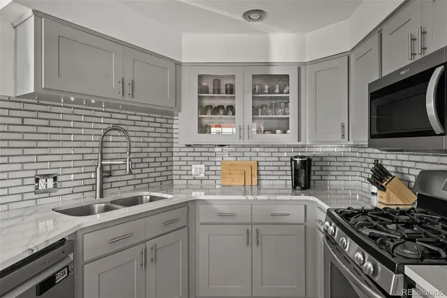a kitchen with a sink and cabinets