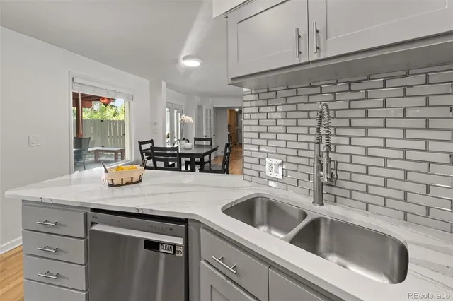 a kitchen with a sink and cabinets