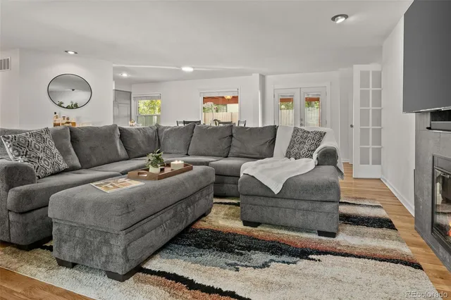 a bedroom with a bed and a flat tv screen