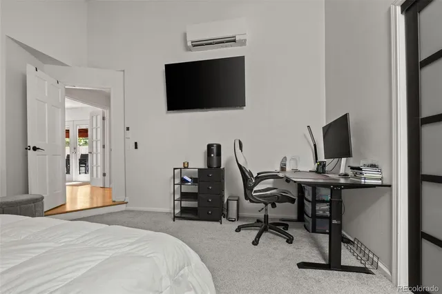a bathroom with a toilet a sink and glass door shower