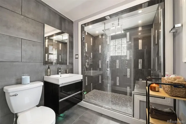 a view of a bathroom with a glass door shower