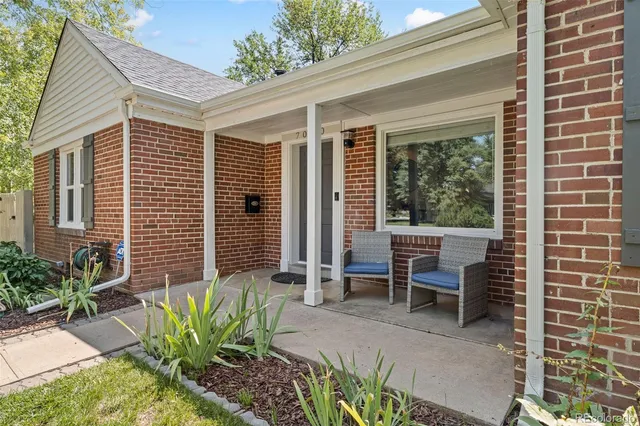 a view of a patio with table and chairs and potted plants