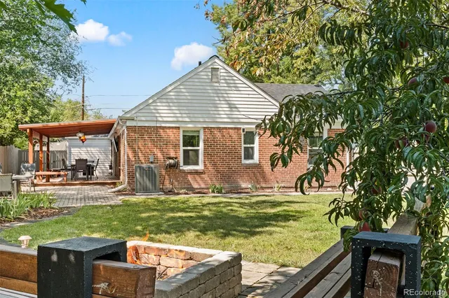 a view of a backyard with sitting area