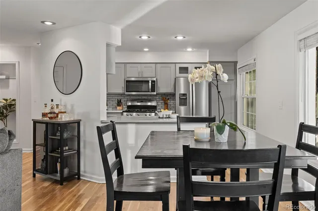 a kitchen with stainless steel appliances a refrigerator sink and microwave