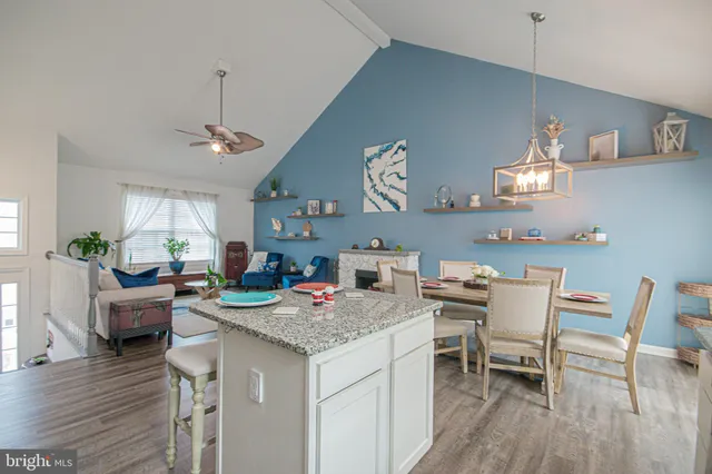 a bedroom with a bed and a flat tv screen on wall