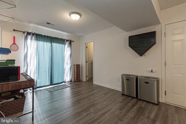 a outdoor living space with patio furniture and a fireplace