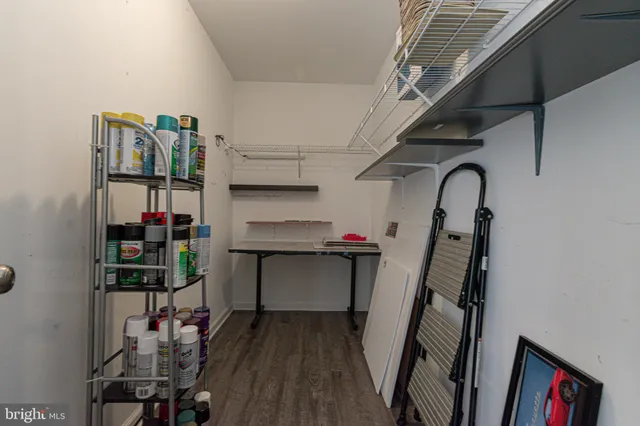 a view of a big house with a big yard and large tree